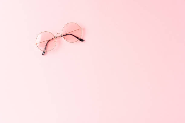 istock Round sunglasses on pink background. Flat lay 1313265608