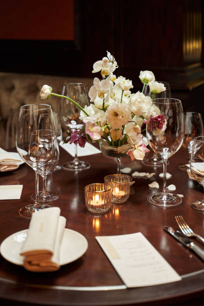 istock table with transparent glasses and burning candles. 1313266301
