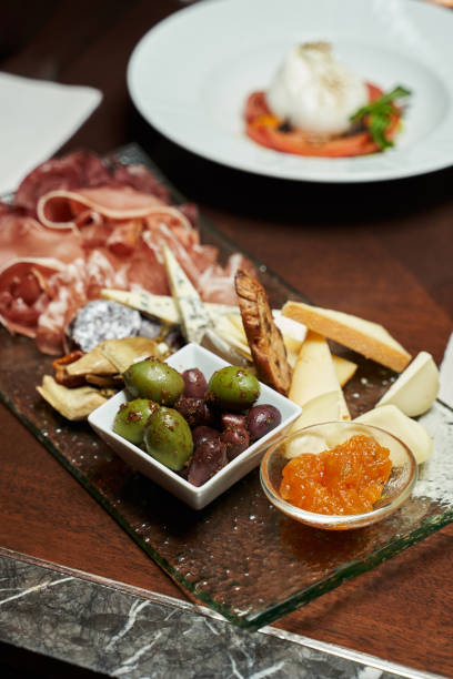 istock selective focus. snacks on the table. focus on large green and black olives 1313266713