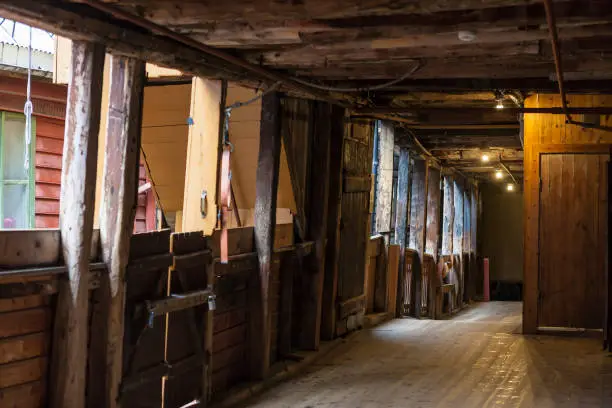 First-floor gallery in Bellgården, an ancient passageway in Bryggen, the area of Hanseatic heritage commercial buildings lining the eastern side of the Vågen harbour, Bergen, Hordaland, Norway.  Bryggen has been on the UNESCO list for World Cultural Heritage sites since 1979.
