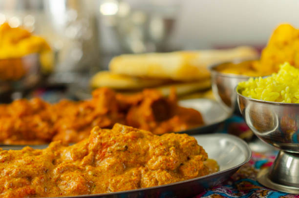 Chicken Madras and Chicken Tikka Masala with Pilau Rice, Naan Breads and, Onion Bhajis