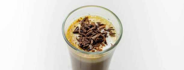 istock Coffee drink shot with a nutty note with fluffy milk foam, decorated with chocolate shavings 1313269916