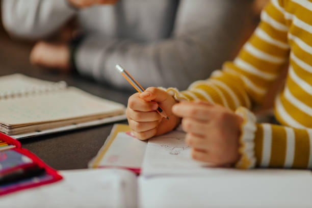 istock Little girl doing her homework at home 1313271422