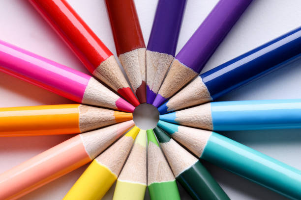 istock Multicolored pencils lying in shape of sun closeup 1313275547