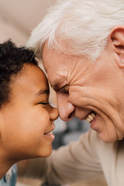 istock Boy bonding with his node to his grandfather while showing his love to him 1313279169