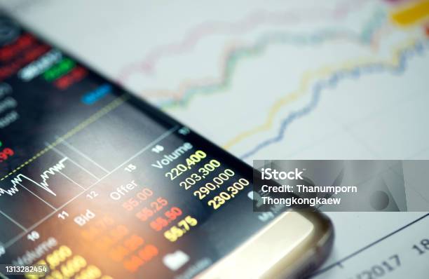 Trading Online On The Smart Phone New Ways To Make Economy And Trading Stock Photo - Download Image Now