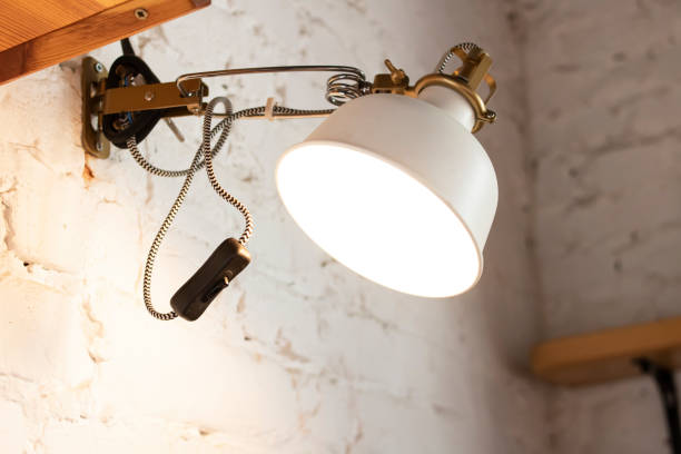 istock Electric lamp on a white brick wall 1313284694