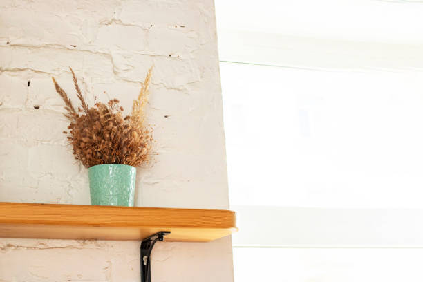 istock Herbarium bouquet on wooden shelf by window 1313284783