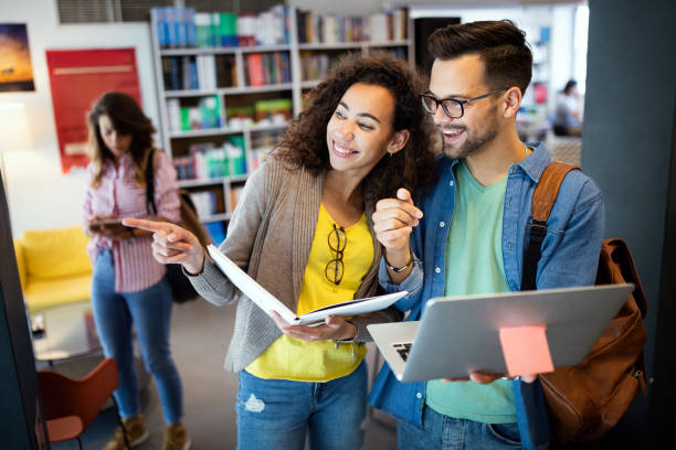 istock Group of students study at library. Learning and preparing for university exam. 1313286215