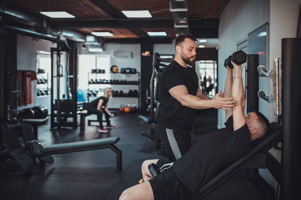 istock Man training with fitness instructor 1313287334