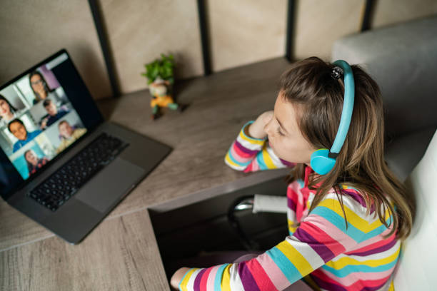 istock Girl talking to her friends during video call 1313287575