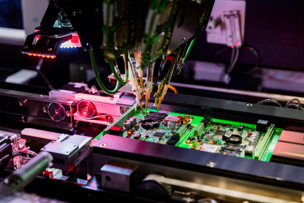 istock Electronic circuit board production and computer chip fly test by robotic automated machine 1313287814