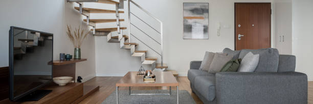 istock Simple living room in two-floor apartment, panorama 1313292081