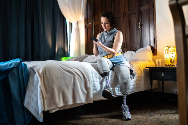 istock Woman with disability using smartphone at home 1313292312