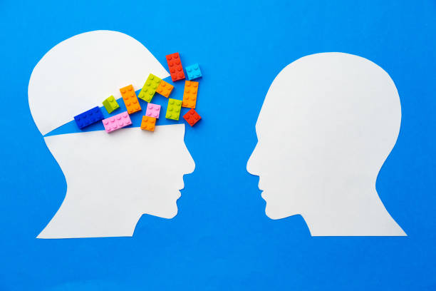 istock Papercut silhouette of human head with colorful constructor pieces 1313292474