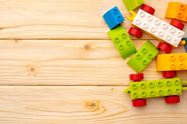 istock Toy constructor details on wooden background close up 1313293333