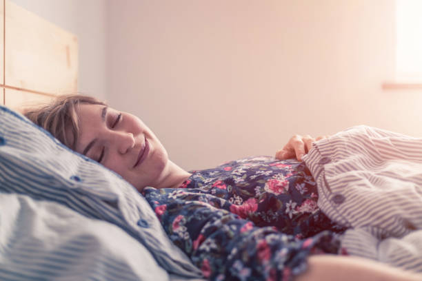 istock Restful sleep: Young female is sleeping in her bed, close up 1313296813