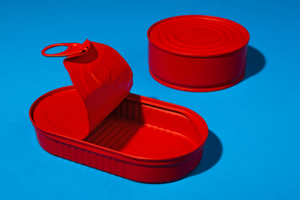 istock Red tin can on blue background close up 1313296970