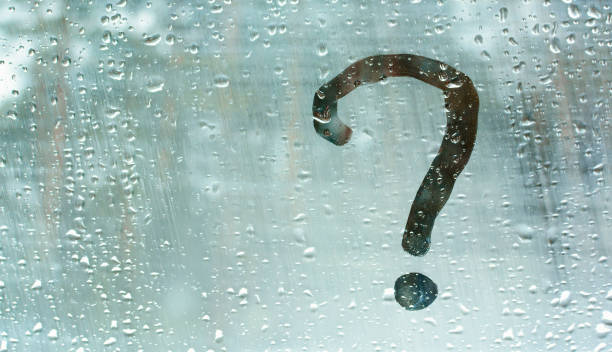istock Question sign on dwarf glass with rain drops. 1313297117