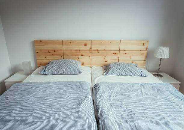 istock Stone pine bed: Empty wooden bed with pillow and blanket 1313297847