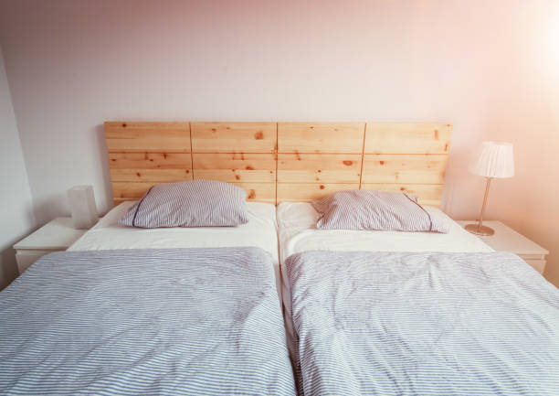 istock Stone pine bed: Empty wooden bed with pillow and blanket 1313297851