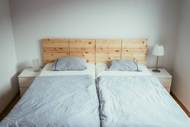 istock Stone pine bed: Empty wooden bed with pillow and blanket 1313297915