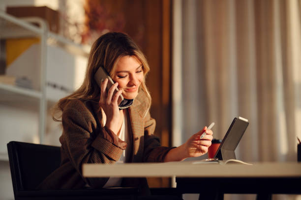 istock Smiling female professional talking on phone 1313298511