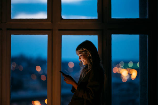 istock Smiling female entrepreneur using smart phone 1313298573