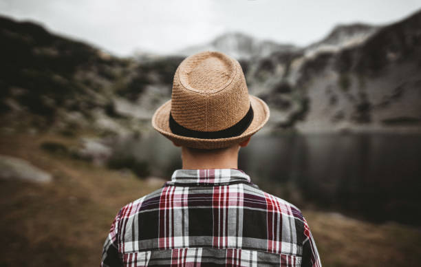 istock Tourist looking at lake in the mountains 1313299869