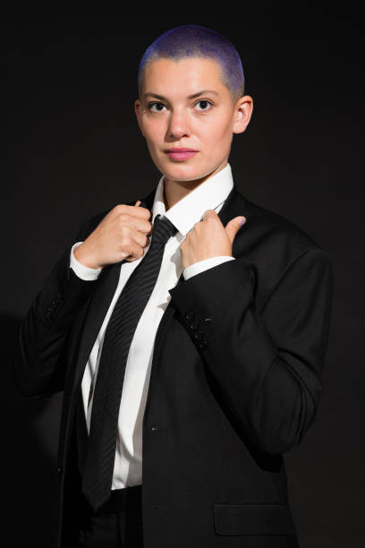 istock Young Citizen in Black Suit, Tie and High Heels 1313300056