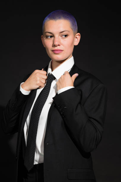 istock Young Citizen in Black Suit, Tie and High Heels 1313300089