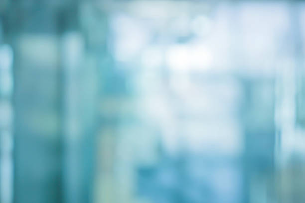 abstrakte unschärfe weicher fokus blau farbe innenraum der modernen reinigung arbeitsplatz hintergrund mit orange glanz licht für design-konzept - büro fotos stock-fotos und bilder