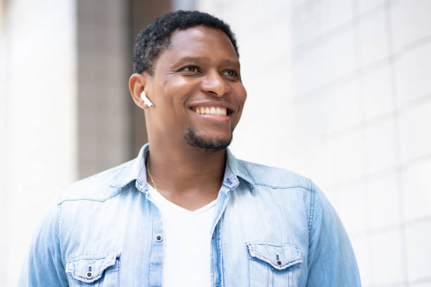 istock African american man smiling while walking outdoors. 1313302131
