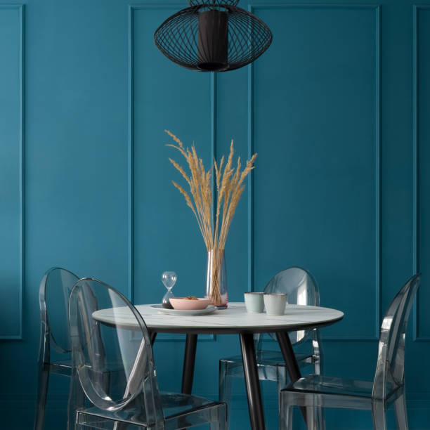 istock Fancy dining room with blue wall with molding 1313303469