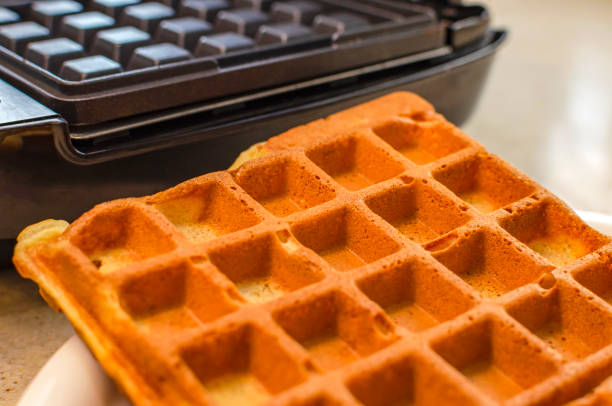 istock Modern waffle maker with ingredients, homemade Belgian waffles 1313305588