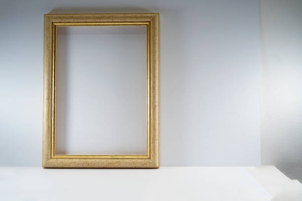 istock Picture frame with wooden frame photographed frontally in the studio with shadows 1313306246