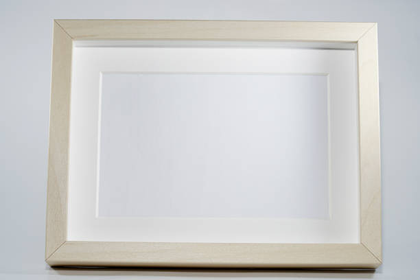 istock Picture frame with wooden frame photographed frontally in the studio with shadows 1313306900