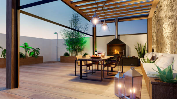 3D render of urban patio at twilight with fire place and wooden table 3D illustration of urban terrace at twilight with fire place and wooden table. Teak wood bioclimatic pergola and flooring. wooden porch stock pictures, royalty-free photos & images