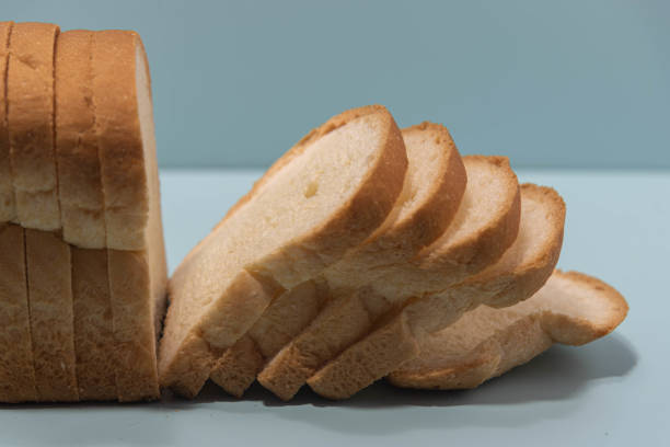 istock Sandwich bread on the bluish background. Wheat bread 1313311111