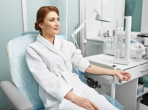 Ozone blood therapy. Adult woman before intravenous ozone therapy at a medical clinic Ozone blood therapy. Adult woman before intravenous ozone therapy at a medical clinic dialysis photos stock pictures, royalty-free photos & images