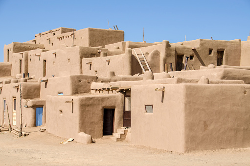 Taos Pueblo is a thousand years old adobe village at the foot of the Sangre de Christo mountains of northern New Mexico, USA. It is a UNESCO World Heritage site. It is divided by the Rio Pueblo into two sections. This photo shows part of the north section.