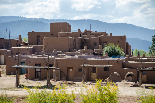 Taos Pueblo is a thousand years old adobe village at the foot of the Sangre de Christo mountains of northern New Mexico, USA. It is a UNESCO World Heritage site. It is divided by the Rio Pueblo into two sections. This photo shows the south section.
