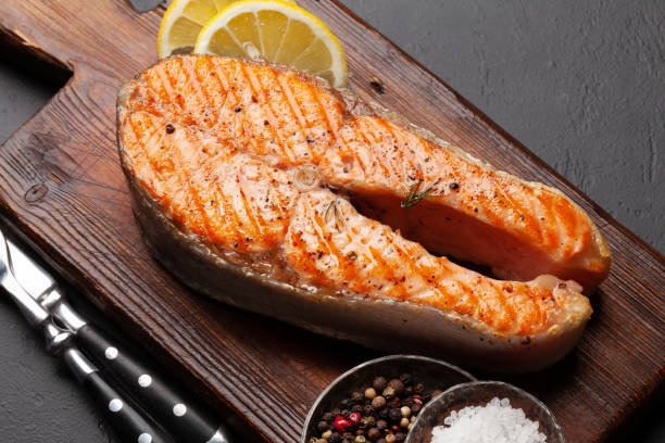 istock Grilled salmon steak. Fish steak with herbs and spices 1313316108