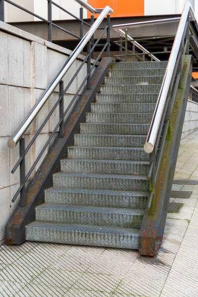 istock Corrugated metal staircase with shiny chrome handrails 1313317519