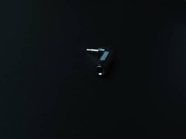 istock Black audio connector on dark background. 1313318486