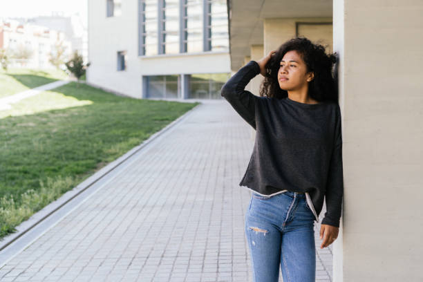 istock Afro girl touching her hair. Space for copy space 1313318732