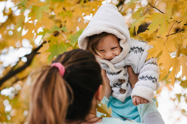istock Mother lifting her daughter 1313320811