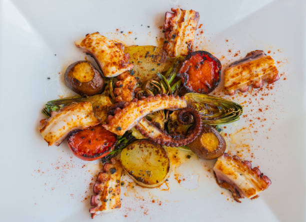 istock Top view of plate of octopus with assorted vegetables 1313320998