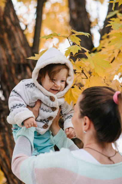 istock Mother lifting her daughter 1313321221