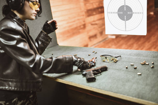 istock Female Choosing Revolver For Firearm Training 1313321295
